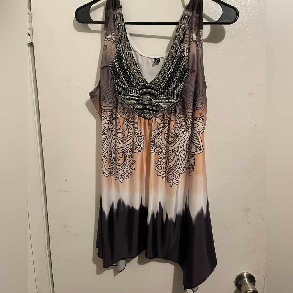 Fashions plus size top in 4X.  Multi-color with beaded detail in front.